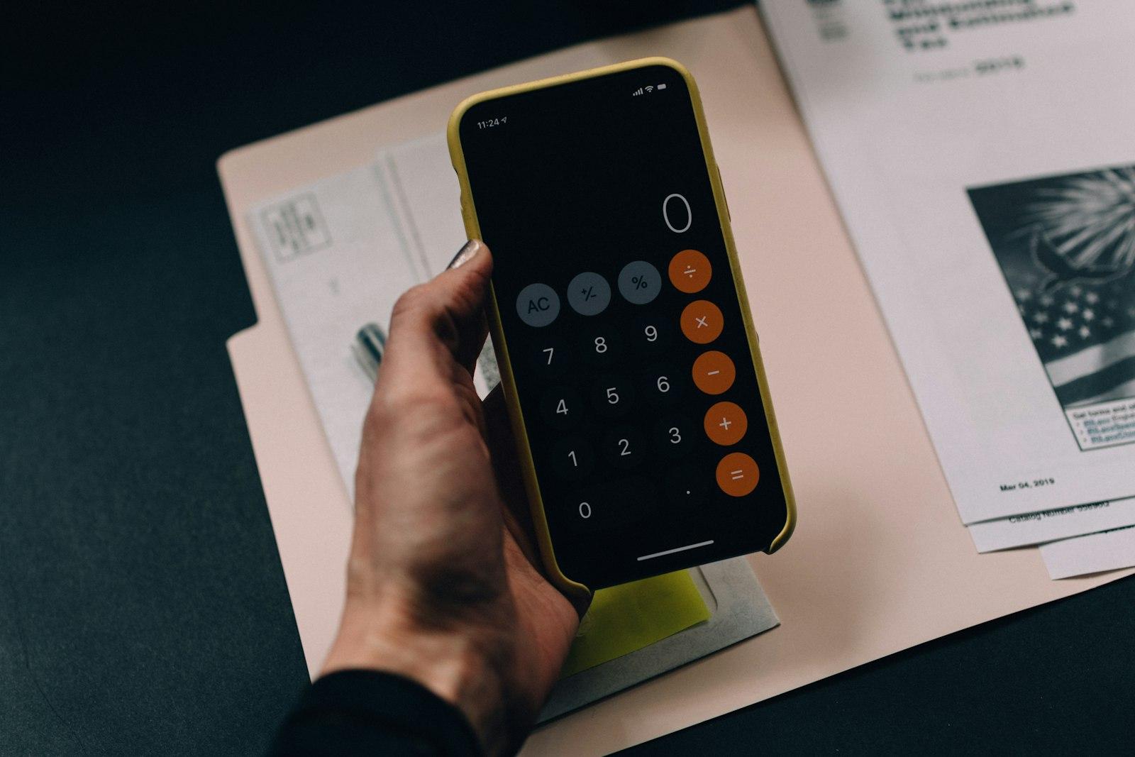 Calculator and paperwork used to work out a stock valuation