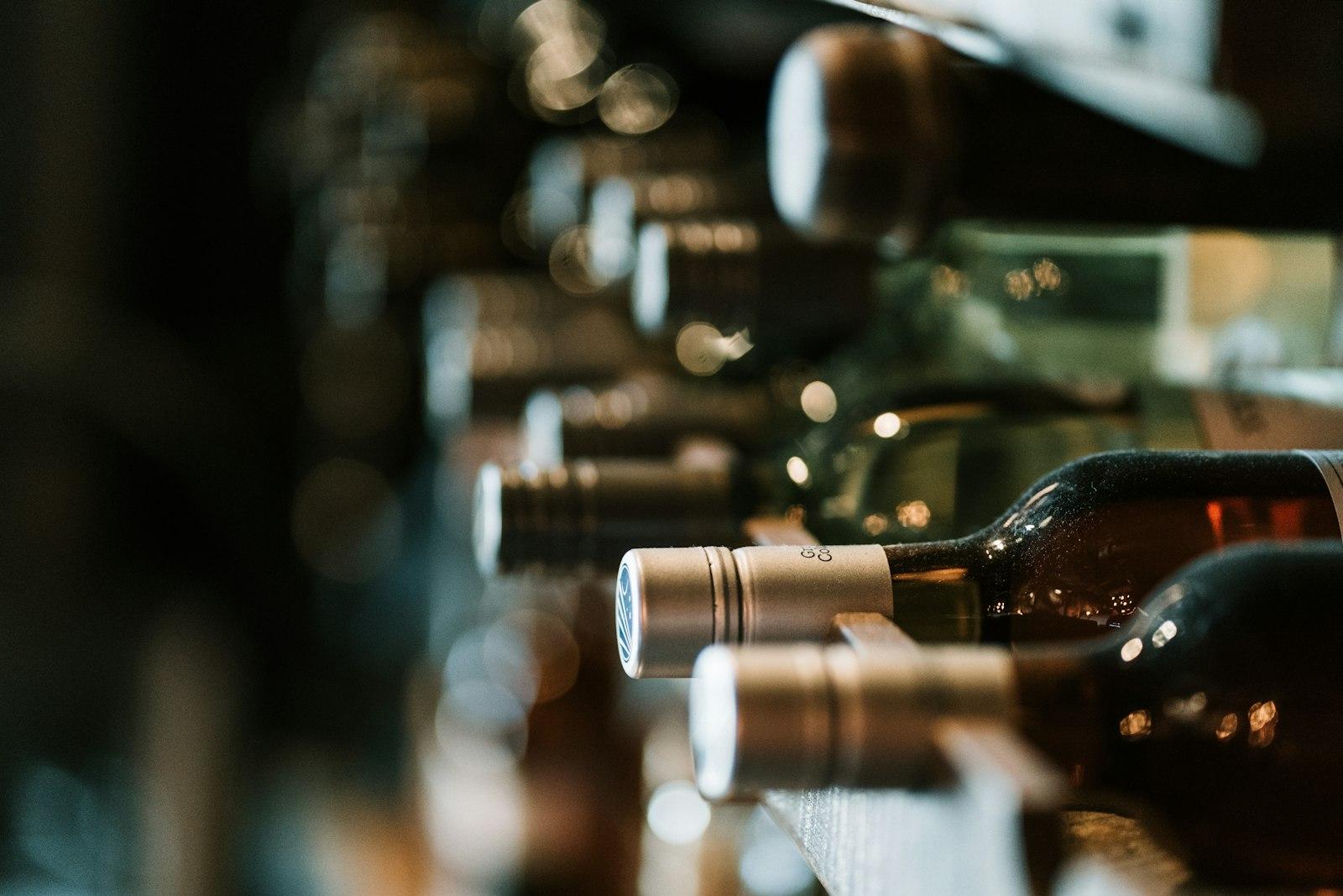 Wine bottles stored on their sides in a rack