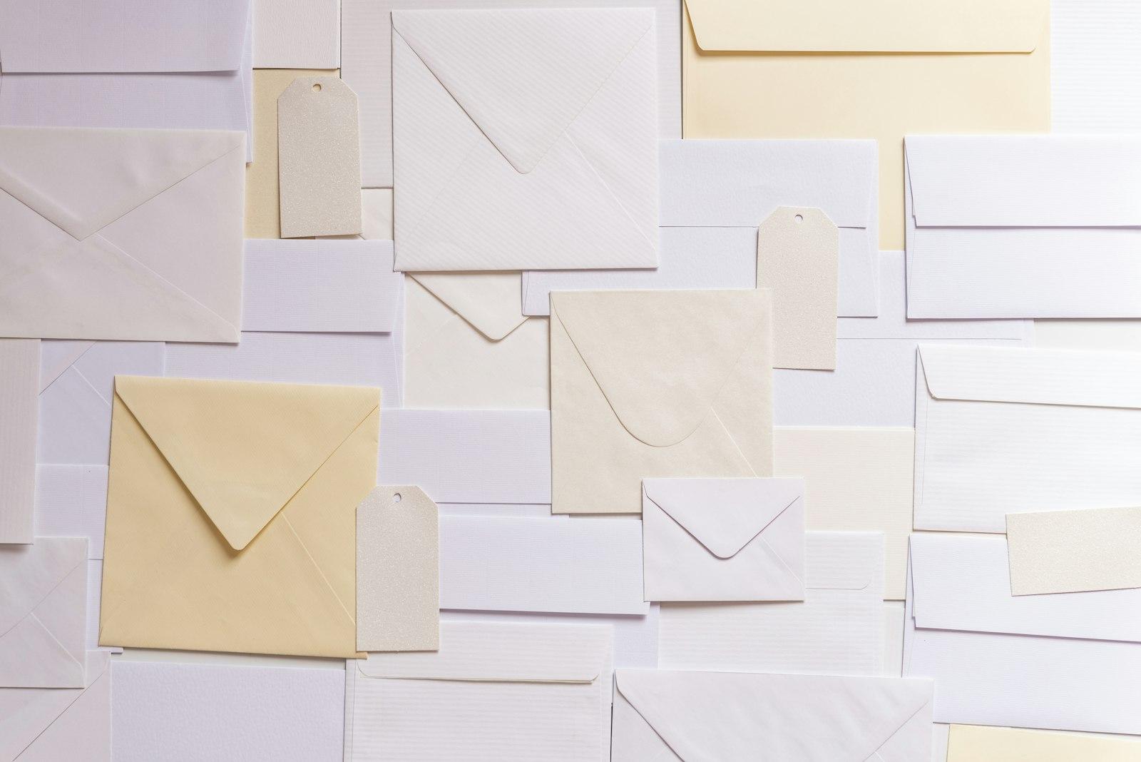 Assorted plain envelopes of different sizes and colours