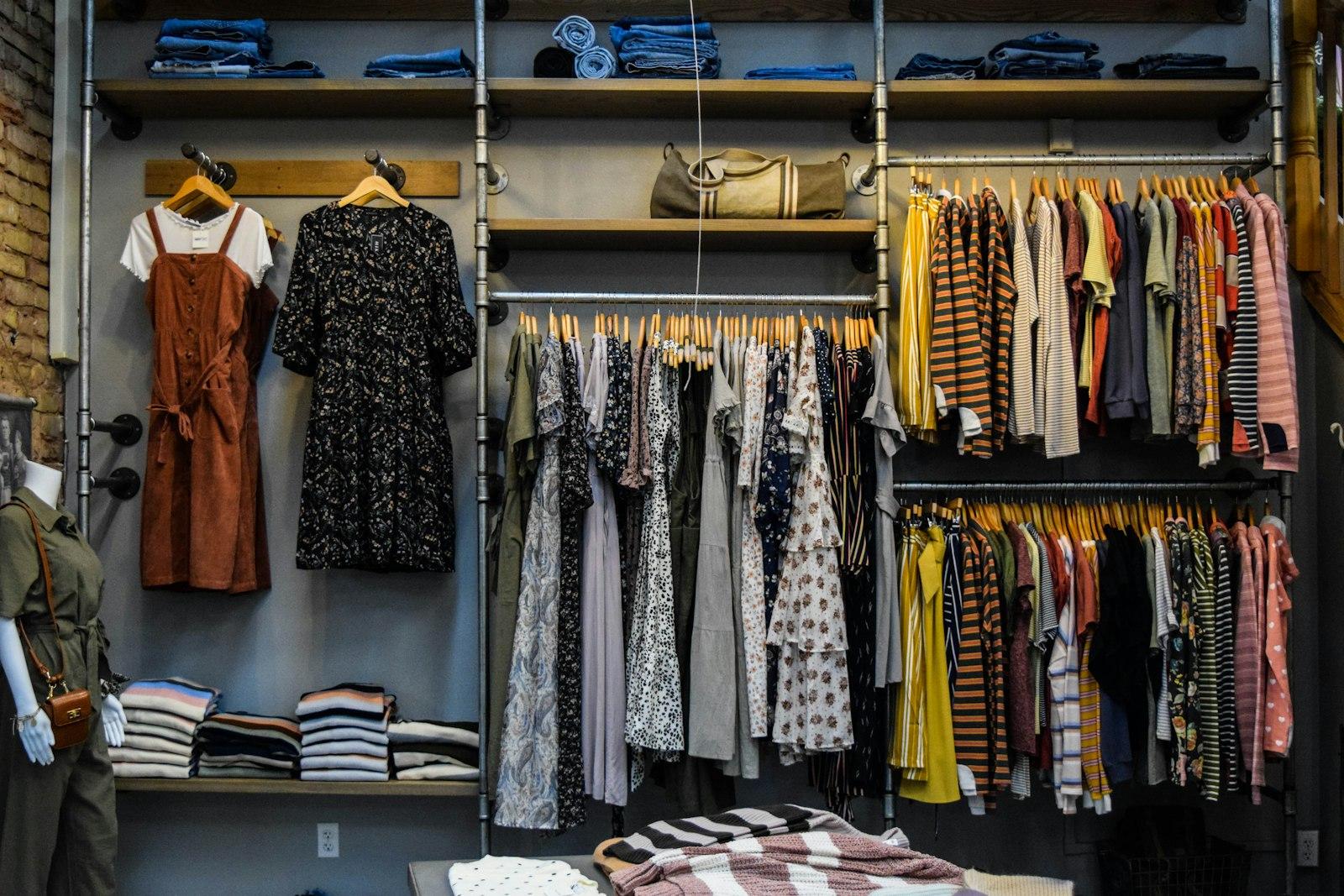 Clothing rails and shelves of folded stock in an independent boutique