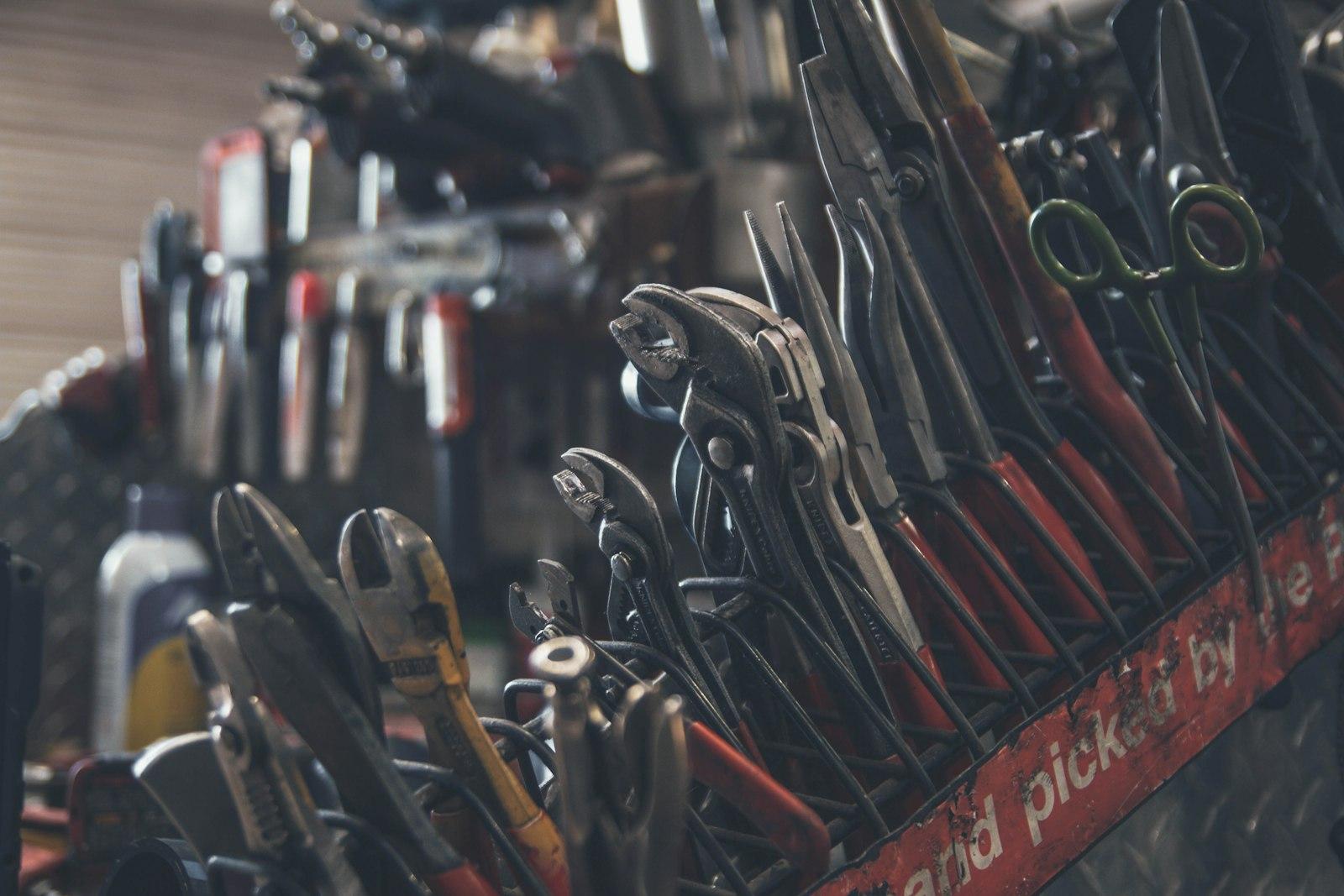 Pliers, wrenches and hand tools in a shop display rack