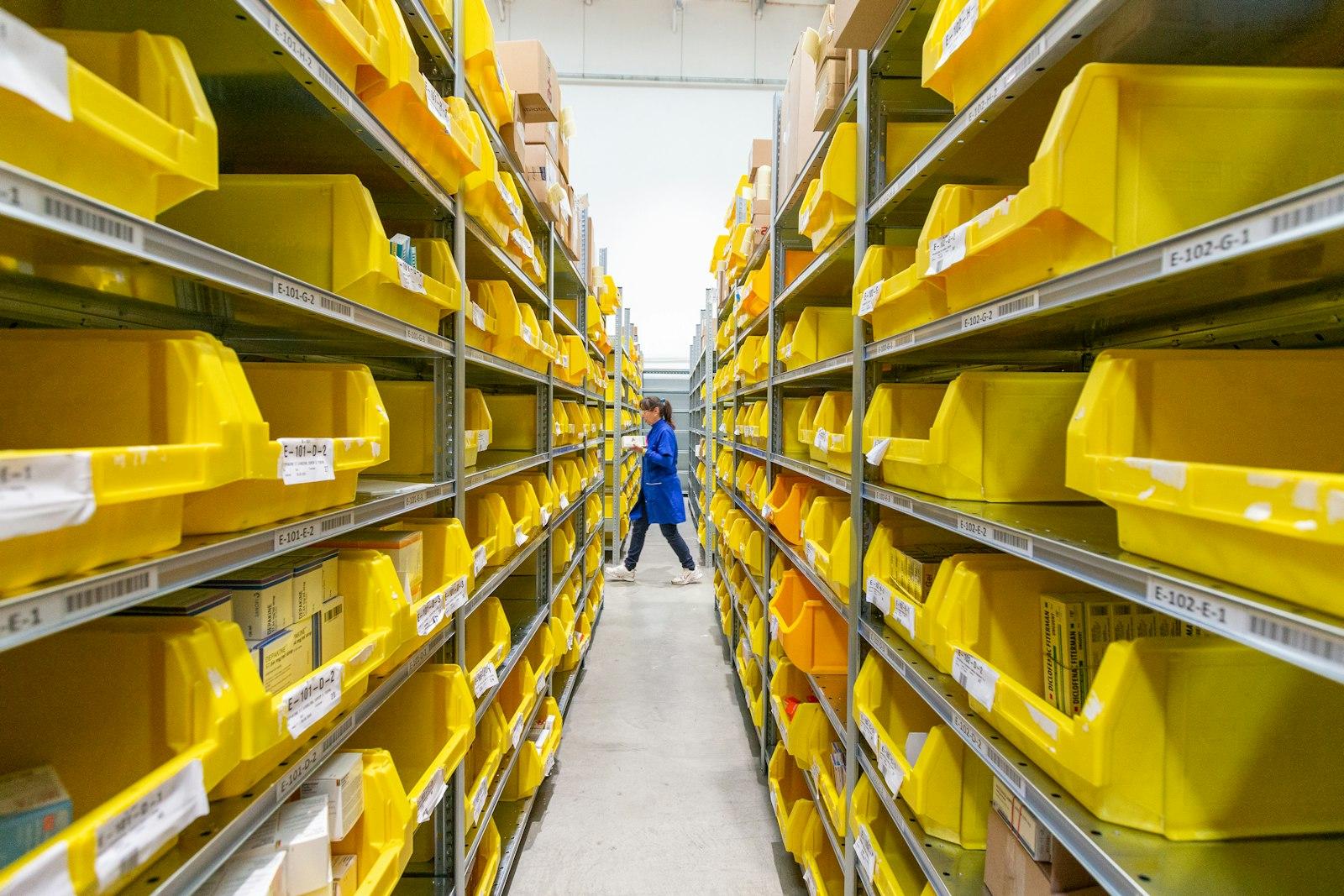 A stocktaker recording stock on a handheld device