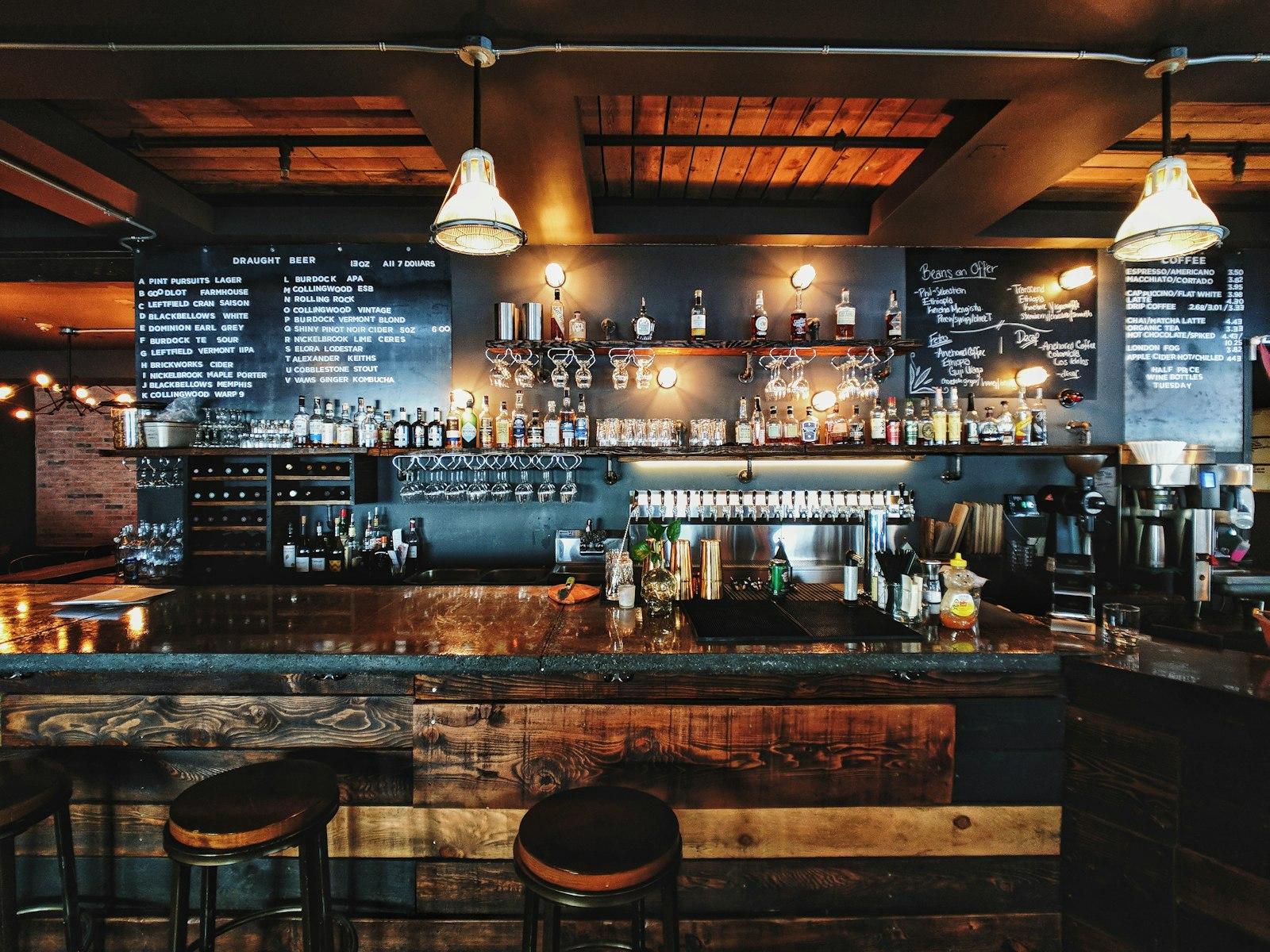 Back bar shelving stocked with spirits, wine and glassware